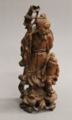 A late 19th/early 20th century Japanese carved wooden figural group. 31 cm high.