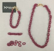 An X jewellery necklace and bracelet.