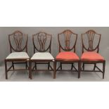 Two pairs of Victorian mahogany shield back dining chairs