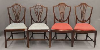 Two pairs of Victorian mahogany shield back dining chairs