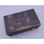 A small 19th century Continental toleware music box, the lid painted with a tavern exterior scene.