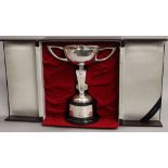 A Japanese silver trophy on stand, boxed. 27.5 cm high overall. 12.5 troy ounces of silver.