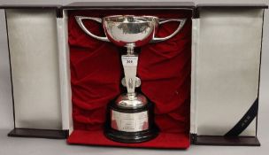 A Japanese silver trophy on stand, boxed. 27.5 cm high overall. 12.5 troy ounces of silver.