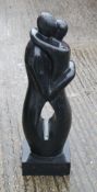 A Terrazzo garden sculpture, Balinese loving couple in black terrazzo. 80 cm high.