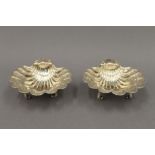 A pair of silver shell form salts. 11.5 cm wide. 10.9 troy ounces.