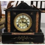 A Victorian black slate and marble mantel clock. 29 cm high.