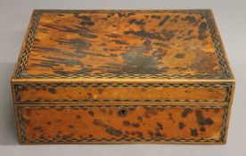 A 19th century tortoiseshell box. 31 cm wide.