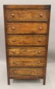 A mid-20th century chest of drawers.