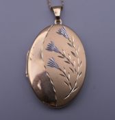 A 9 ct gold locket on a 9 ct gold chain. 3.5 cm high. 8 grammes total weight.