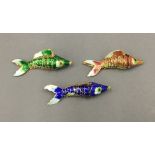Three enamelled decorated fish. Each approximately 8.5 cm long.