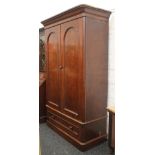 A Victorian mahogany two-door wardrobe. 210 cm high x 132 cm wide.
