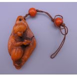 A pendant decorated with a small boy. 6.5 cm high.