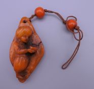 A pendant decorated with a small boy. 6.5 cm high.