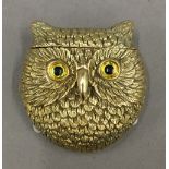 A brass vesta formed as an owl. 4 cm wide.