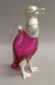 A silver plated cranberry glass duck decanter. 26.5 cm high.