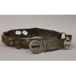 A vintage Boy Scouts leather belt set with military cap badges. 82 cm long.