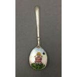 A silver enamel spoon depicting Miss Muffet. 10.5 cm long.