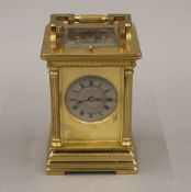 A 19th century brass cased repeating carriage clock. 14 cm high.