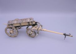 A Napoleonic prisoner of war unmarked white metal mounted bone model carriage. 24.5 cm long.