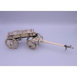 A Napoleonic prisoner of war unmarked white metal mounted bone model carriage. 24.5 cm long.