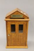 An oak letter box, with brass plate. 38.5 cm high.