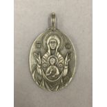 An icon pendant, bearing Russian marks. 5 cm high.