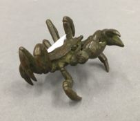 A bronze model of a crab. 5 cm wide.