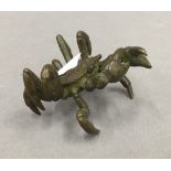 A bronze model of a crab. 5 cm wide.