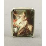 A silver pill box depicting a pair of nudes. 3 cm wide.