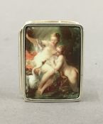 A silver pill box depicting a pair of nudes. 3 cm wide.