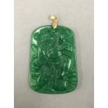 A Chinese jade pendant with small gold mounts. 5.5 cm high.