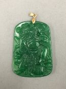 A Chinese jade pendant with small gold mounts. 5.5 cm high.