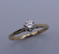 A 9 ct gold diamond solitaire ring. Ring size J. 1.2 grammes total weight.