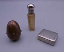 A copper sovereign case, a scent bottle and a small box. The former 4 cm high.