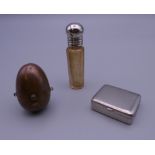 A copper sovereign case, a scent bottle and a small box. The former 4 cm high.