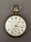 A silver Zenith pocket watch. 5 cm diameter.