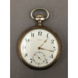 A silver Zenith pocket watch. 5 cm diameter.