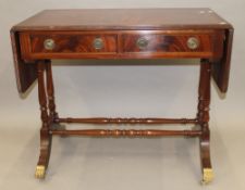 A modern mahogany sofa table.