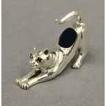 A sterling silver cat formed pin cushion. 4.5 cm long.
