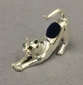 A sterling silver cat formed pin cushion. 4.5 cm long.