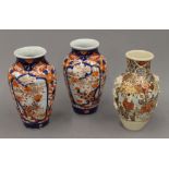 Two late 19th century Imari vases and a Satsuma vase. The latter 15 cm high.