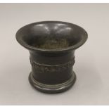 A 17th century bronze mortar. 14 cm high.