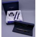 A boxed Dupont silver pen and a boxed Waterman pen set.