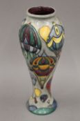 A modern Moorcroft Balloons pattern vase. 27 cm high.