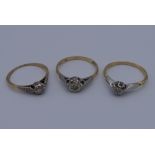 Three 18 ct gold and platinum diamond rings. 7.2 grammes total weight.