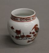 A Chinese porcelain bird feeder. 6 cm high.