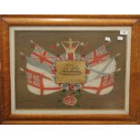A Victorian maple framed wool work picture, centred with a print of HMS Captain. 71 x 55.