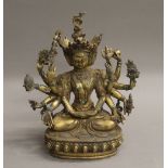 A gilt bronze multi-arm deity. 23 cm high.