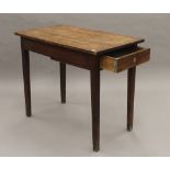 A 19th century oak side table. 91 cm wide.