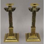 A pair of 19th century brass hand tooled Sri Lankan temple candlesticks. 25 cm high.